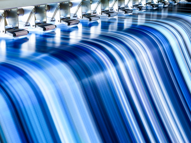 a close up of a printer that has prited stripes in different blue tones