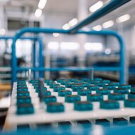 Multiple pump heads for liquid pumps on a tray waiting for assembly.